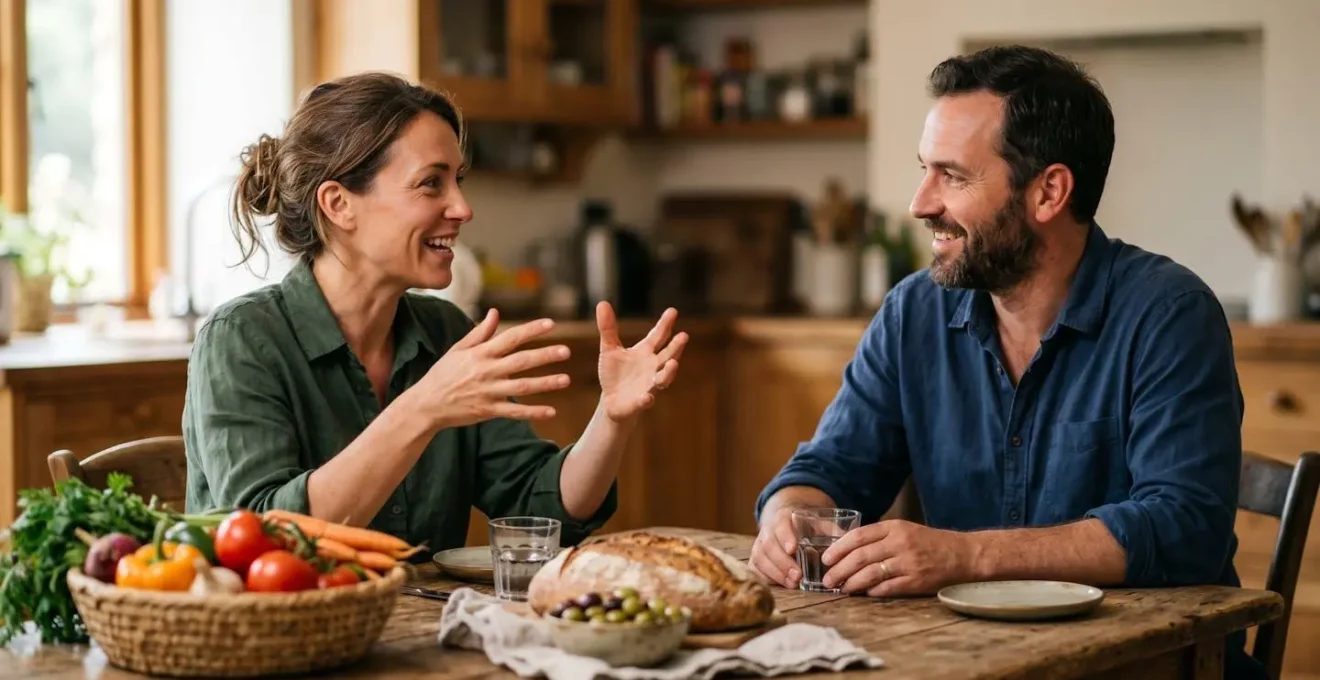 Deux personnes partageant un moment de conversation authentique autour d'une table avec des aliments locaux